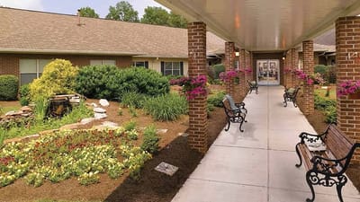 Landscape view of the outdoor space with walking path and benches