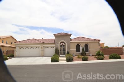 A residential building exterior with landscaping