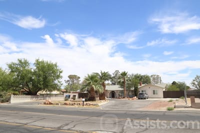 Exterior view of a senior living facility with landscaping