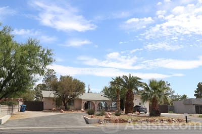 Exterior view of A and J Care Home with landscaping