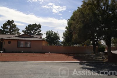 Outdoor view of a senior living facility with trees