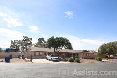 Exterior view of a senior living facility with landscaping