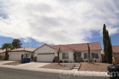 Exterior view of a senior living facility with landscaping