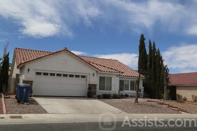 Exterior view of a house with a landscaped yard