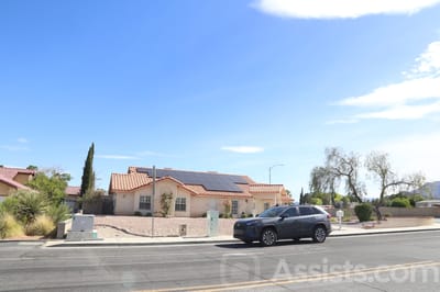 Exterior view of a senior care facility with vehicle