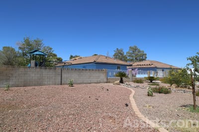 Exterior view of a senior living facility with garden