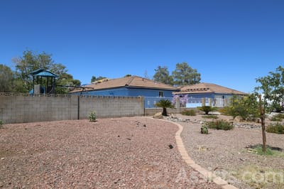 Exterior view of a senior living facility with gardens