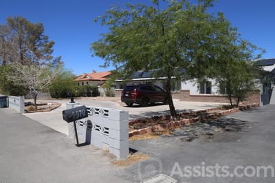 Exterior view of a senior care facility with parking