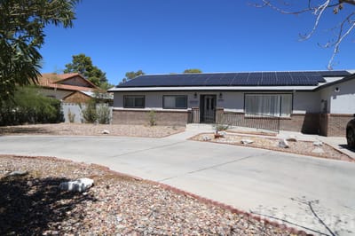 Exterior view of a nursing home facility with a driveway