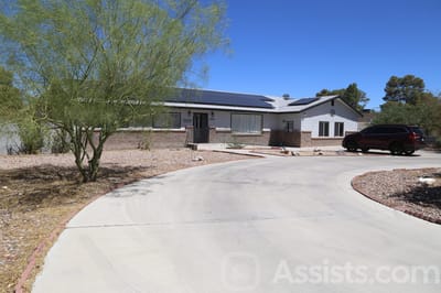 Exterior view of a senior care facility with a landscaped entrance