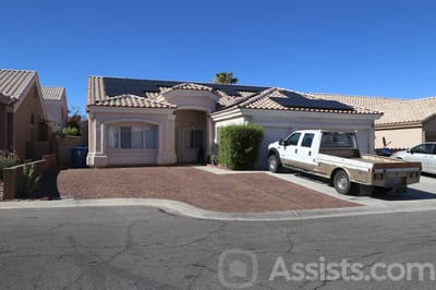 Exterior view of a home with a truck parked outside