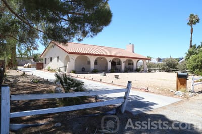 Exterior view of Golden Villa Care Home with a landscaped entrance