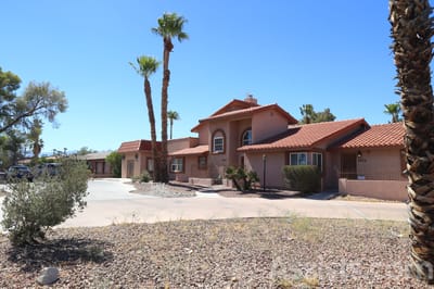 Exterior view of Livingston Home II with palm trees