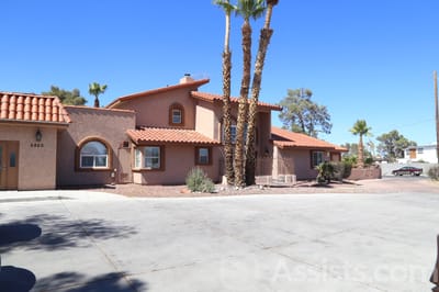 Exterior view of Livingston Home II with palm trees