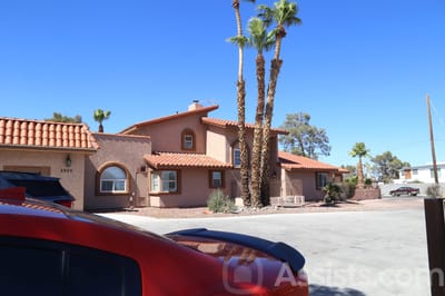 Exterior view of Livingston Home II with palm trees