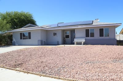 Exterior view of a senior care facility with solar panels