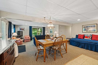 Cozy communal living area with seating and dining table