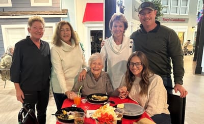 Staff and residents enjoying a meal together
