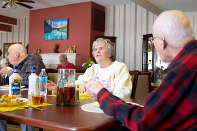 Residents enjoying a meal in the dining area