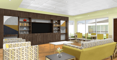 Bright common area with seating and a large TV
