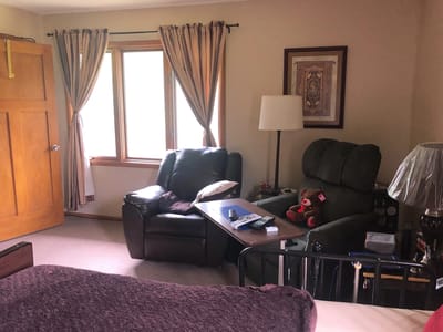 Cozy private room with seating area and window