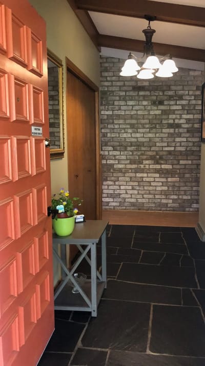 Interior hallway with a welcoming orange door