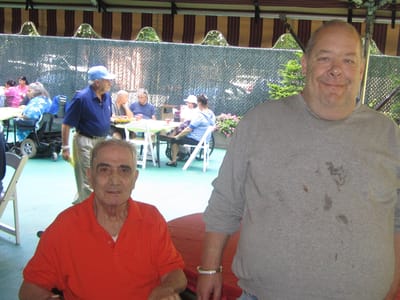Residents enjoying an outdoor gathering at the facility
