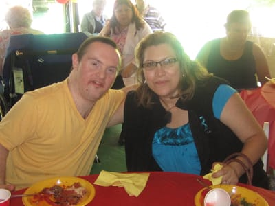 Residents enjoying a meal together at a celebration