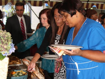Residents enjoying a buffet meal at an outdoor event