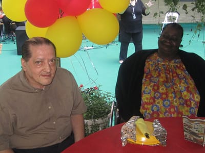 Residents enjoying a celebration with balloons outdoors
