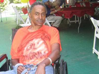 Resident enjoying an outdoor celebration at the facility