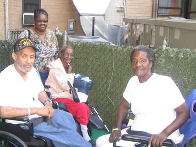Residents enjoying time outdoors in wheelchairs