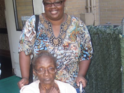 Supportive staff with a resident in a comfortable setting