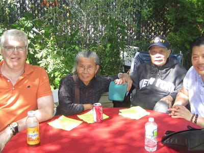 Residents enjoying a sunny day at an outdoor gathering