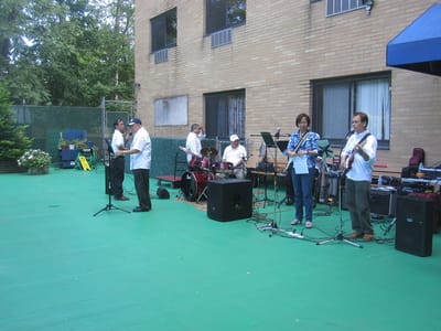 Residents enjoying live music performance outdoors