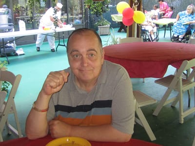 Resident enjoying an outdoor celebration with decorations