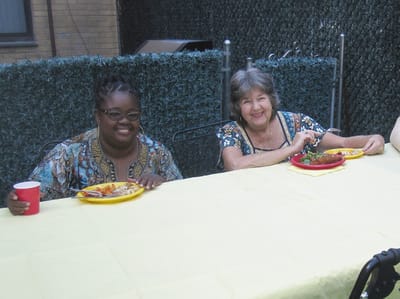 Residents enjoying a meal together at a table
