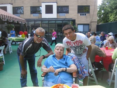 Residents and staff enjoying an outdoor gathering