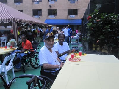 Residents enjoying a meal at an outdoor event