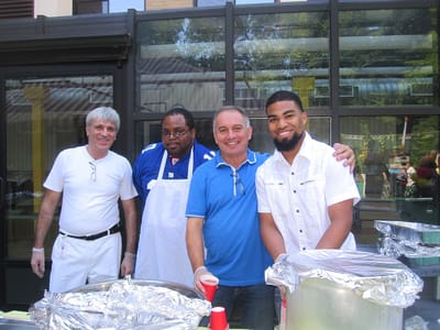 Staff and guests at an outdoor food event