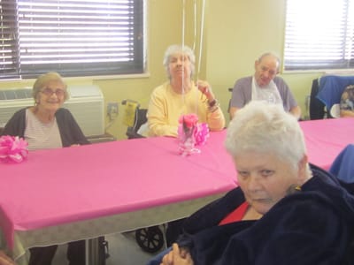 Residents sitting at a table during an event