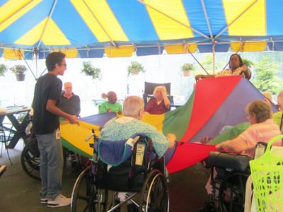 Residents participating in a colorful outdoor activity