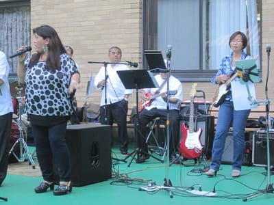 Residents enjoying live music performance outdoors