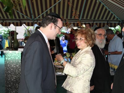 Guests interacting at a dining event with food