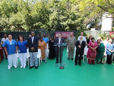 Group of residents and staff gathered outdoors for an event