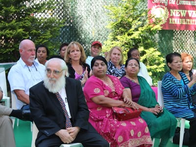 Residents and staff attending a community event outdoors