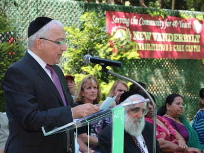 A speaker at an outdoor community event