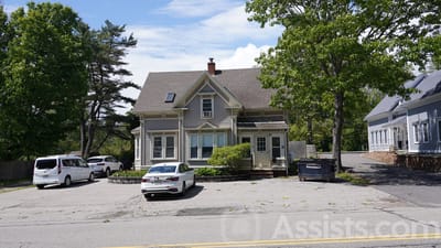 Exterior view of Woodbridge Group Home with parking.