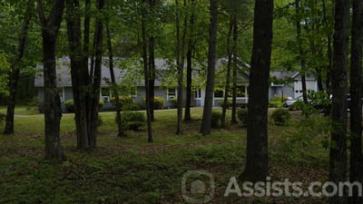 A view of the facility surrounded by trees