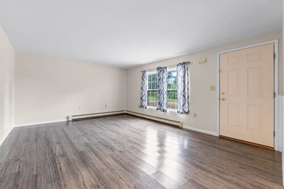 Bright interior room with windows and door